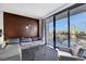 Stylish living space offers a cozy seating area, an entertainment unit, and a panoramic city view from the balcony at 4381 W Flamingo Rd # 2220, Las Vegas, NV 89103