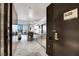 Open-concept living space with a kitchen area, bar seating, a work space, and natural light with a city view at 4381 W Flamingo Rd # 2220, Las Vegas, NV 89103