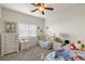 Shared bedroom with twin beds, matching nightstands, and natural light from the window at 4780 Lorenzo Way, Pahrump, NV 89061