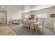 Formal dining room with decorative furniture and ample natural light from large windows at 4780 Lorenzo Way, Pahrump, NV 89061
