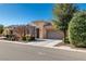 Charming single-story home with desert landscaping and a two-car garage at 4780 Lorenzo Way, Pahrump, NV 89061