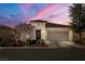 Inviting single-story home showcasing manicured front yard and two-car garage at 4780 Lorenzo Way, Pahrump, NV 89061