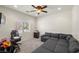 Spacious living room featuring a large sectional sofa and ample natural light at 4780 Lorenzo Way, Pahrump, NV 89061