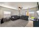 Bright and airy living room with sliding glass doors to the backyard and comfortable seating at 4780 Lorenzo Way, Pahrump, NV 89061