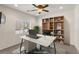 Home office featuring a built-in bookshelf, large window, and modern desk and chair at 4780 Lorenzo Way, Pahrump, NV 89061