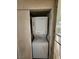 Enclosed laundry area with stacked washer and dryer at 4805 S Torrey Pines Dr # 101, Las Vegas, NV 89103