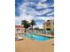 Community pool with lounge chairs and palm trees at 4805 S Torrey Pines Dr # 101, Las Vegas, NV 89103