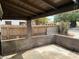 View of a back porch with brick wall and fence, offering a secluded outdoor space at 524 5Th St, Boulder City, NV 89005