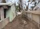 Photo of the side yard with green grass, fencing, and mature trees providing privacy and a natural setting at 524 5Th St, Boulder City, NV 89005