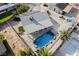 Aerial view of backyard with pool, turf, and solar panels on roof at 5453 Yvonne Cir, Las Vegas, NV 89122