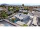 Residence showcasing a sparkling in-ground pool and a covered car port area in a private backyard at 5453 Yvonne Cir, Las Vegas, NV 89122