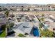 Home featuring pool, solar panels, detached garage, and landscaping at 5453 Yvonne Cir, Las Vegas, NV 89122