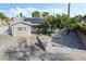 An aerial view of the home's exterior and driveway featuring solar panels on the roof at 5453 Yvonne Cir, Las Vegas, NV 89122