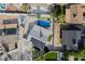 Aerial view of community featuring a pool, solar panels, and green turf yard at 5453 Yvonne Cir, Las Vegas, NV 89122