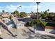 Overhead shot of a well-kept residence featuring a pool, desert landscaping, and solar panels at 5453 Yvonne Cir, Las Vegas, NV 89122