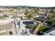An aerial view of the home shows mature landscaping, solar panels, and an artificial grass backyard at 5453 Yvonne Cir, Las Vegas, NV 89122