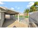 The backyard features a covered patio with pool access and mature landscaping at 5453 Yvonne Cir, Las Vegas, NV 89122