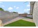 Backyard space with gravel, patch of grass and cinder block wall at 5453 Yvonne Cir, Las Vegas, NV 89122