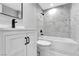 Modern bathroom with single vanity and tiled tub and shower combo at 5453 Yvonne Cir, Las Vegas, NV 89122