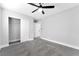 Bedroom with ceiling fan, closet with sliding doors and neutral carpet at 5453 Yvonne Cir, Las Vegas, NV 89122