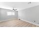 Bedroom with ceiling fan and wood-look vinyl flooring at 5453 Yvonne Cir, Las Vegas, NV 89122