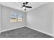 A sunlit bedroom with gray carpet and white trim offers a peaceful retreat at 5453 Yvonne Cir, Las Vegas, NV 89122