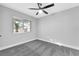 Well-lit bedroom with plush carpet and window offering neighborhood views at 5453 Yvonne Cir, Las Vegas, NV 89122