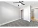 This bedroom features neutral paint, plush gray carpet, and a sliding door closet at 5453 Yvonne Cir, Las Vegas, NV 89122