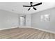 Bonus room with ceiling fan and wood-look vinyl flooring at 5453 Yvonne Cir, Las Vegas, NV 89122