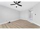 Bonus room with ceiling fan and wood-look vinyl flooring at 5453 Yvonne Cir, Las Vegas, NV 89122