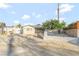 Inviting single-story home featuring mature tree, gravel landscaping, and a concrete driveway at 5453 Yvonne Cir, Las Vegas, NV 89122