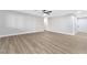 The living room has a ceiling fan, hardwood floors, and plenty of open space at 5453 Yvonne Cir, Las Vegas, NV 89122