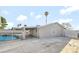 Exterior view of the rear of the home with covered parking, in-ground pool and large private lot at 5453 Yvonne Cir, Las Vegas, NV 89122