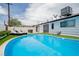 Relax in the backyard pool, featuring an outdoor patio and refreshing water at 6301 Garwood Ave, Las Vegas, NV 89107