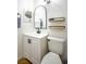 Half bathroom featuring a contemporary vanity, sleek mirror, and modern fixtures providing a comfortable experience at 6301 Garwood Ave, Las Vegas, NV 89107