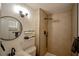 Modern bathroom featuring a sleek vanity, updated fixtures, and a tiled shower with a black shower head at 6301 Garwood Ave, Las Vegas, NV 89107