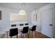 Cozy dining room with modern lighting, seating for six, and a peaceful atmosphere at 6301 Garwood Ave, Las Vegas, NV 89107