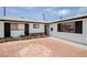 Exterior facade features xeriscape landscaping with clean lines and crisp black and white accents at 6301 Garwood Ave, Las Vegas, NV 89107
