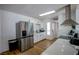 Bright kitchen with stainless appliances, light countertops, and white cabinetry, perfect for cooking at 6301 Garwood Ave, Las Vegas, NV 89107