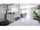 Open floor plan showcasing a modern kitchen flowing into a cozy living area with fireplace at 6301 Garwood Ave, Las Vegas, NV 89107