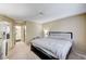 This bright bedroom features neutral decor and has a connected bathroom and walk-in closet at 6735 W Charleston Blvd # 4, Las Vegas, NV 89146
