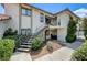 Two-story condo with stairs, small patio and desert landscaping provides curb appeal at 6735 W Charleston Blvd # 4, Las Vegas, NV 89146