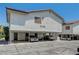 Condo building featuring multiple carports and the address 6735 at 6735 W Charleston Blvd # 4, Las Vegas, NV 89146