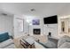 Spacious living room featuring a fireplace, neutral carpet and ample lighting at 6735 W Charleston Blvd # 4, Las Vegas, NV 89146