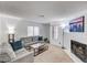 Bright living room with a fireplace, neutral carpet and comfortable seating at 6735 W Charleston Blvd # 4, Las Vegas, NV 89146