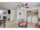 Open living space featuring a dining area, fireplace, and laundry closet for convenient living at 6735 W Charleston Blvd # 4, Las Vegas, NV 89146