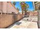 Home's backyard featuring a concrete pad and drought-resistant landscaping at 6961 Ray Charles Ln, Las Vegas, NV 89119