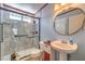 Cozy bathroom featuring shower, toilet, and sink at 6961 Ray Charles Ln, Las Vegas, NV 89119