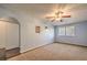 Bedroom featuring neutral carpeting, closet, and an adjoining entry room at 6961 Ray Charles Ln, Las Vegas, NV 89119