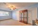 Comfortable bedroom with ceiling fan, closet, neutral carpeting, and ample space at 6961 Ray Charles Ln, Las Vegas, NV 89119